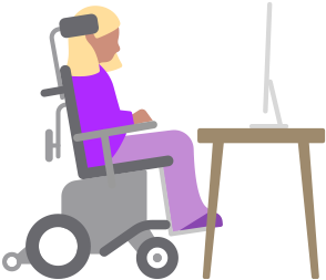 Una persona en una silla de ruedas motorizada ve una computadora Mac ubicada en un escritorio